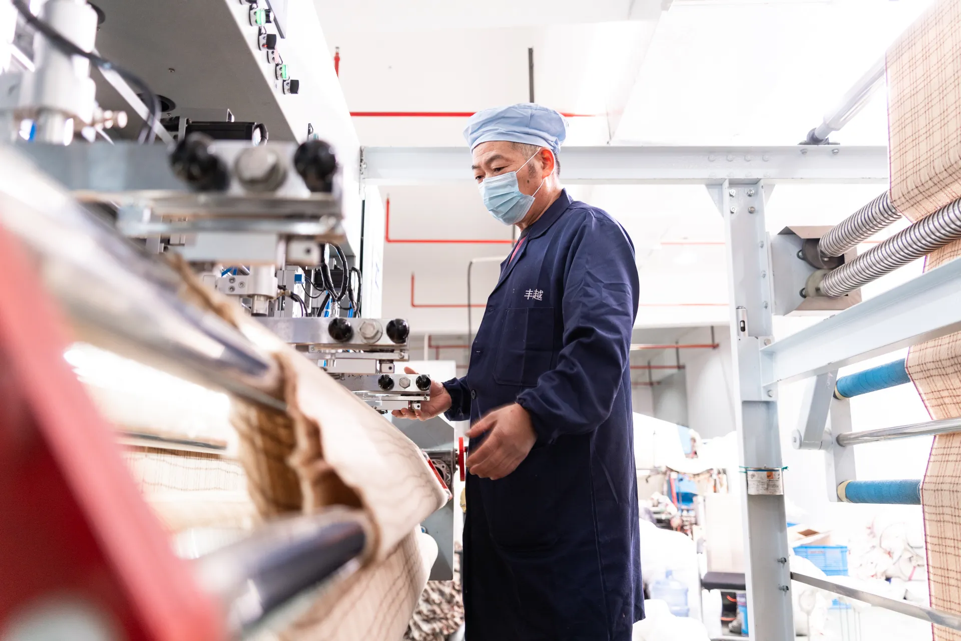 Worker operating loom